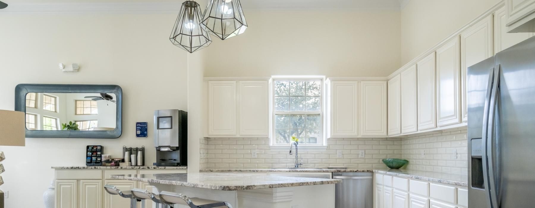 a kitchen with white cabinets