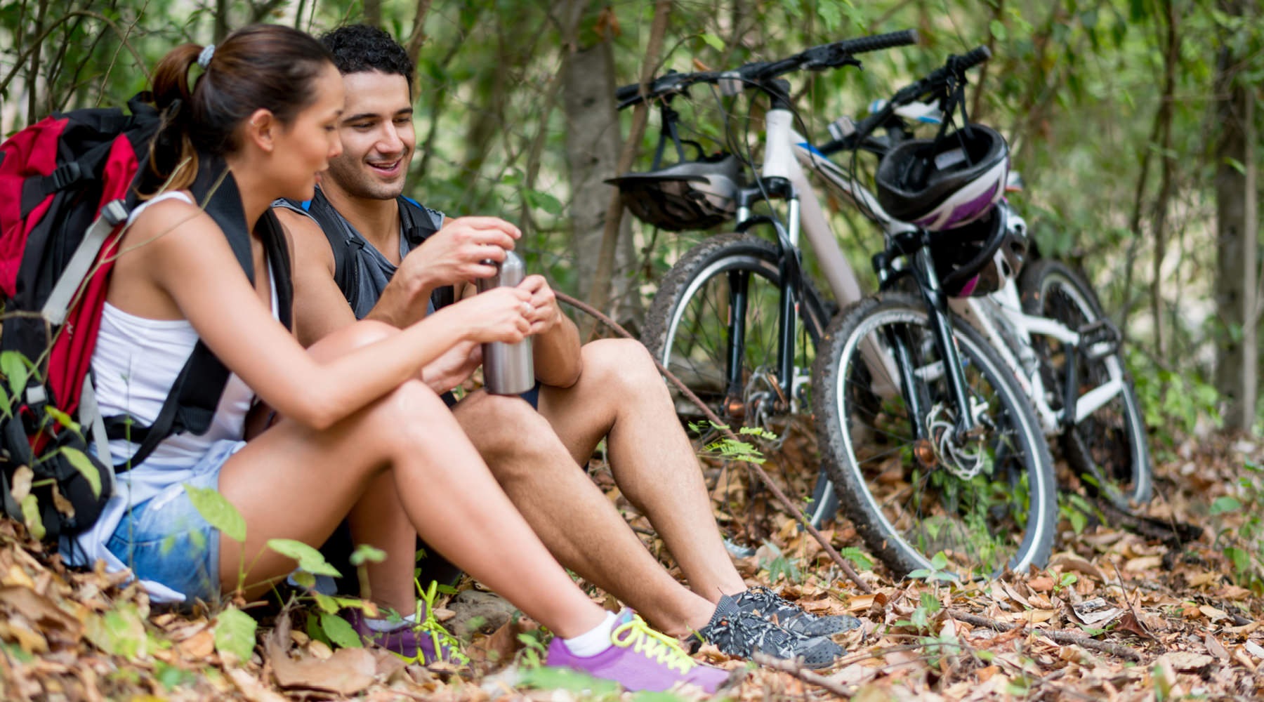 a couple riding bikes