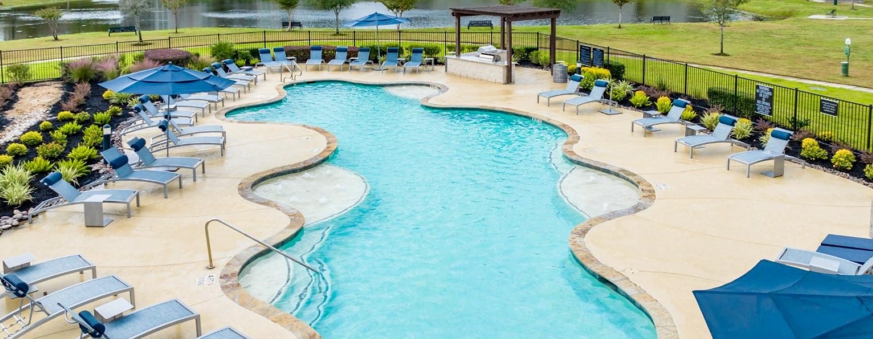 a pool with a building in the background