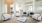 a spacious room with white furniture