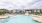 a pool with a building in the background