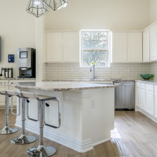a kitchen with white cabinets