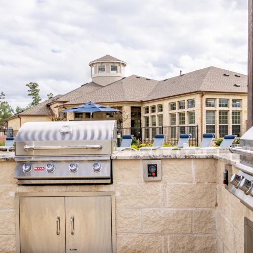 a grilling area near a pool