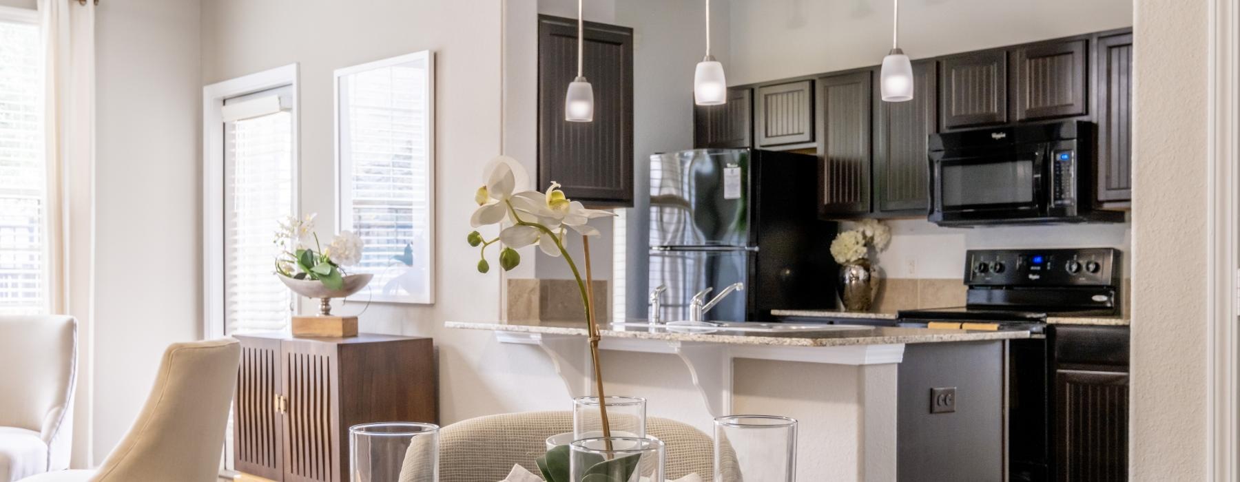 a kitchen with a table set