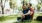 two people sitting on the grass